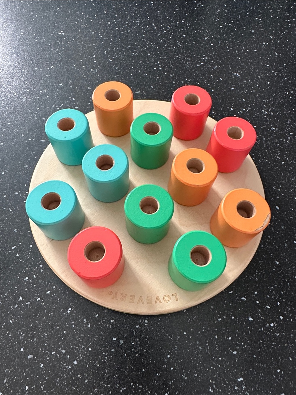 Lovevery wooden peg stacking board